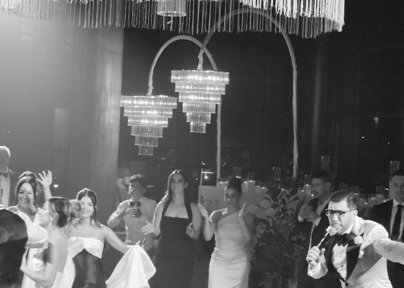 Guests celebrating at a black tie wedding